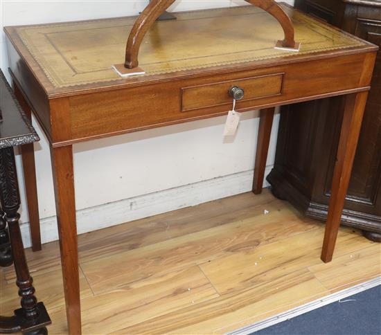 A leather top mahogany writing table W.92cm